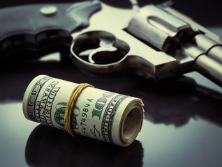 Gun and money concept
