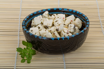 Cheese with spices and oil