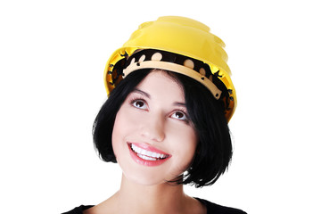 Portrait of a woman with hardhat looking up