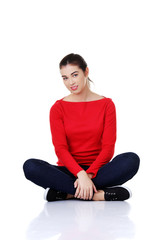 Full length woman sitting cross-legged