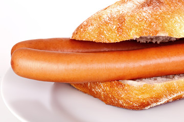 Bun with wieners on the plate