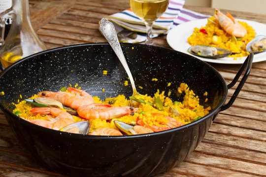 Seafood paella in black pan