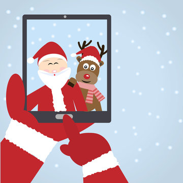 Santa Claus selfie with reindeer