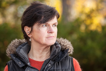 Portrait of a middle aged woman in autumn