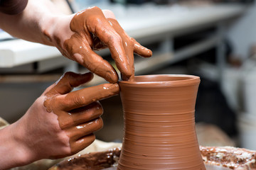 potter, creating an earthen jar