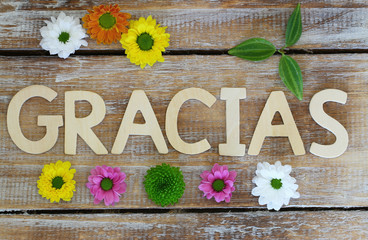 Gracias (thank you in Spanish) written with wooden letters