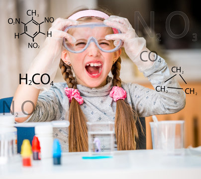 girl with flasks for chemistry