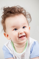 Fototapeta premium cute smiling baby with funny hair