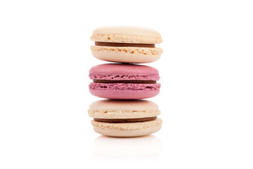 Three multicolored stacked macaroons isolated