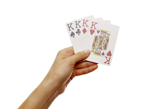 Hand h&auml;lt vier K&ouml;nige