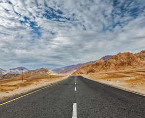 Road  in Himalayas with mountains