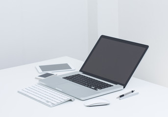 Fototapeta premium Blank screen Laptop computer with gedget