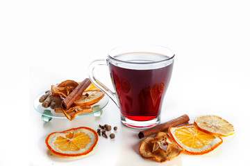 mulled wine with spices, ginger, cinnamon on a white background