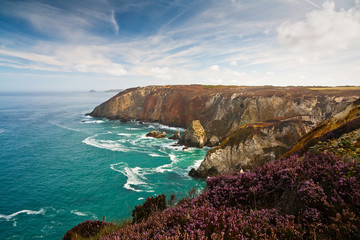 Fototapeta premium Cliffs coloured by different minerals, Cornwall, UK.