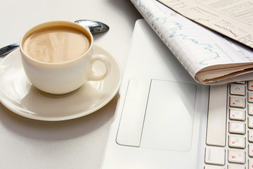 Cup of coffee near press.