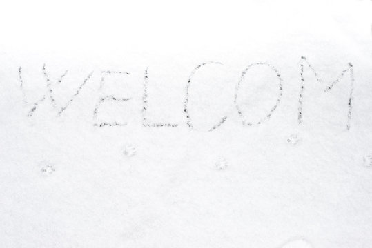 inscription welcom on snow-covered ice