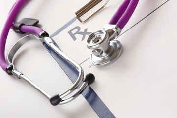 Closeup of a stethoscope on an rx prescription - obrazy, fototapety, plakaty