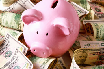 piggy bank on dollars.