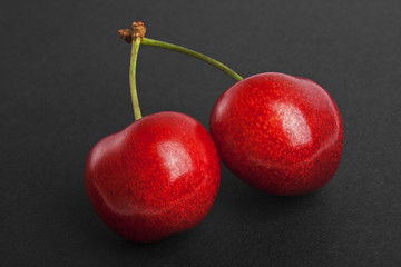 Cherry berries isolated on a black background