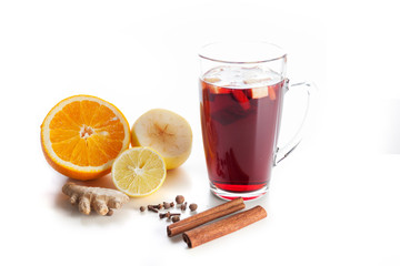 mulled wine with spices, ginger, cinnamon on a white background
