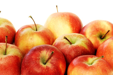 A lot of red apples close up on white background