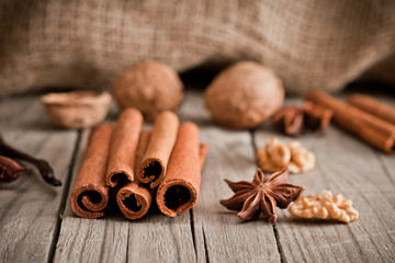 closeup of walnut, star anise, vanilla and cinnamon