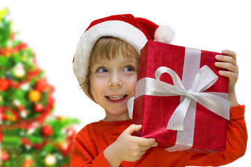 Cute kid with a Santa hat holding a present box