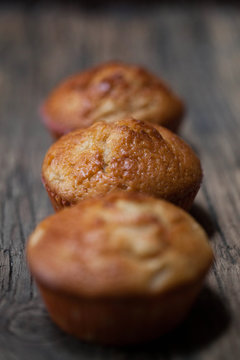 delicious homemade muffins over wooden board