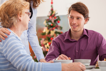 Man talking with his grandmother