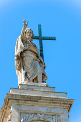 Statue at the top of Basilica of Saint John Lateran in Rome, Ita