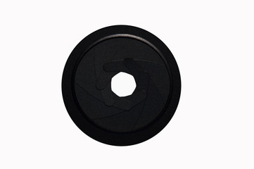 Photographic aperture partially open with a white background.