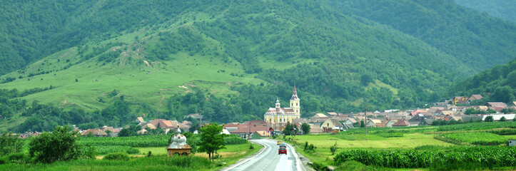 Scenic road to a traditional mountain village in Romania..