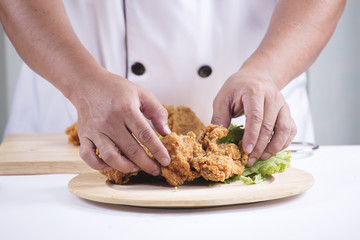 chef cook preparing fried chicken