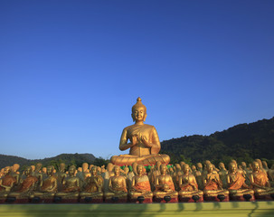 big buddha statue in buddhist religious temple with beautiful mo