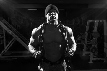 Fototapeta premium Athlete with chains in the gym