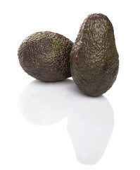 Ripe avocado fruit over white background
