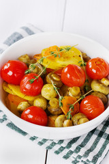 baked potatoes with carrots, mushrooms and cherry tomatoes