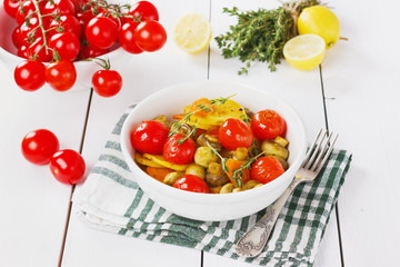 baked potatoes with carrots, mushrooms and cherry tomatoes