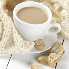 Coffee with cookies and knitwear