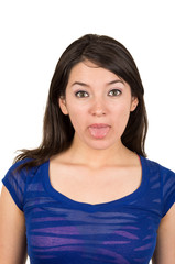 closeup portrait of beautiful young girl posing with tongue out