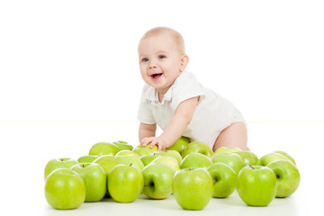 Fototapeta premium Smiling baby and many green apples