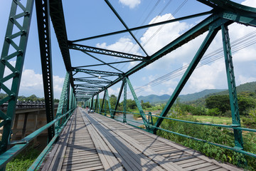 Fototapeta premium iron bridge at pai river in thailand