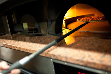 A pizza in a oven burning
