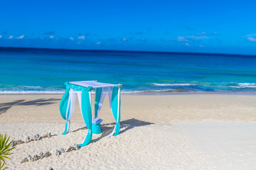 beautiful wedding arch on tropical sand beach, outdoor beach wed