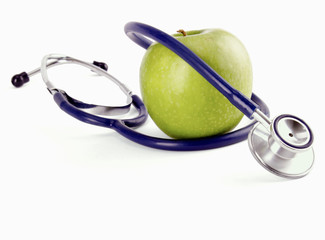 Medical stethoscope and apple, isolated on white background