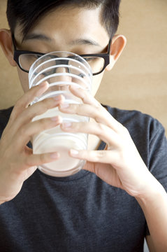 Young Asian Drinking Milk