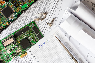 Plan for the repair of the computer, a notebook with a pen