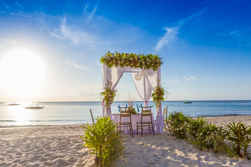 wedding arch and set up on beach, tropical outdoor wedding caban