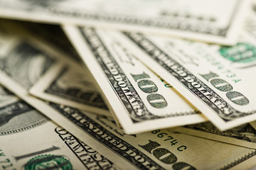 Fototapeta premium Stack of one hundred dollar bills close-up