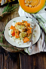 Pumpkin and chicken baked in cream with a side dish of rice